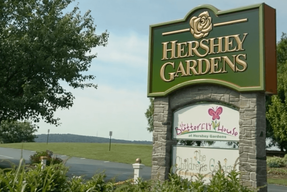 Sign for Hershey Gardens, featuring the Butterfly House and Children's Garden.